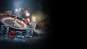 A professional dealer in a tuxedo greeting players at the roulette table, symbolizing the authentic live casino feel at XXBB.