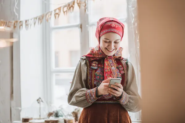 A woman in a luxurious green gown next to an ornate roulette wheel, capturing the upscale casino mood of XXBB.